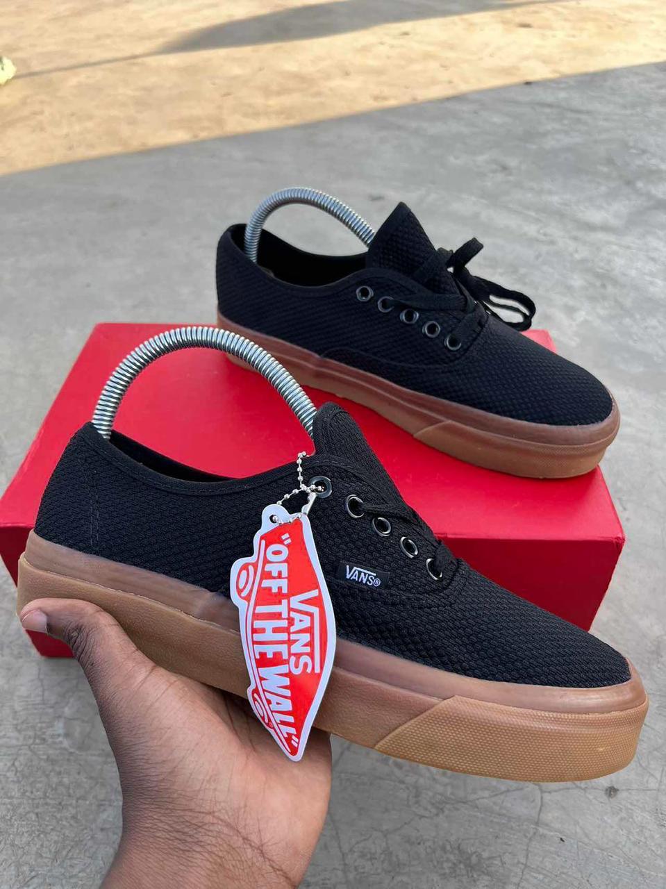 Vans off the walls black and brown